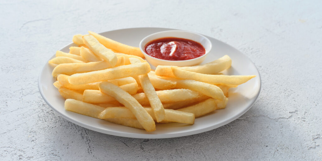 showing an image of straight cut fries on a plate with dipping sauce